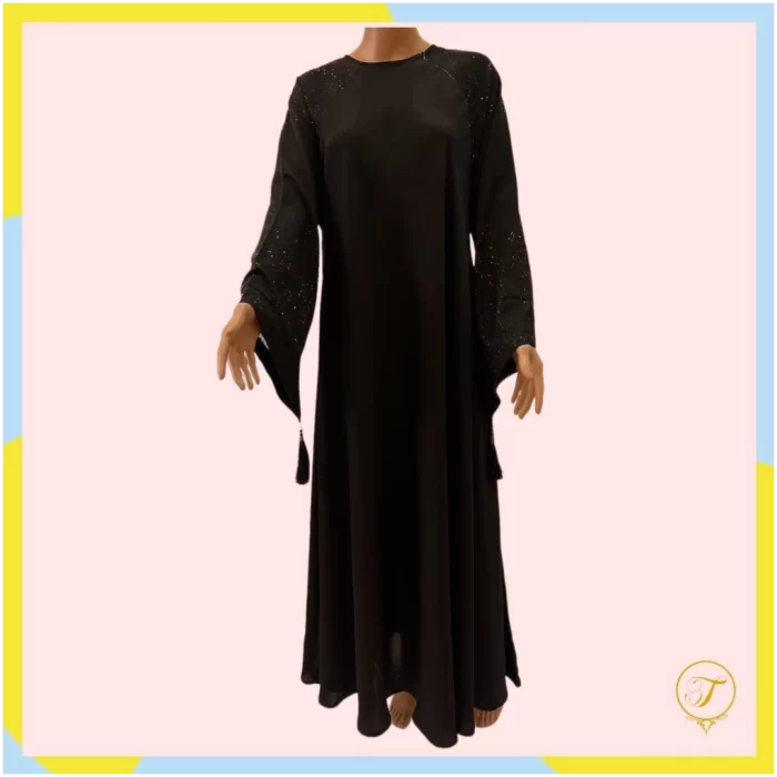 The embroidery on the abaya is skillfully done, featuring intricate patterns or motifs that enhance its visual appeal. The addition of beads adds a touch