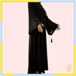 The embroidery on the abaya is skillfully done, featuring intricate patterns or motifs that enhance its visual appeal. The addition of beads adds a touch of sophistication and sparkle