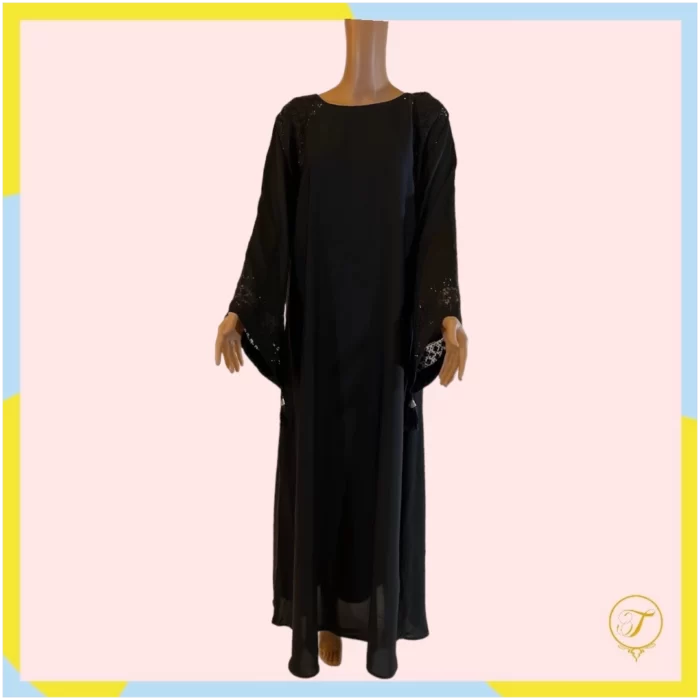 The embroidery on the abaya is skillfully done, featuring intricate patterns or motifs that enhance its visual appeal. The addition of beads adds a touch of sophistication and sparkle, creating