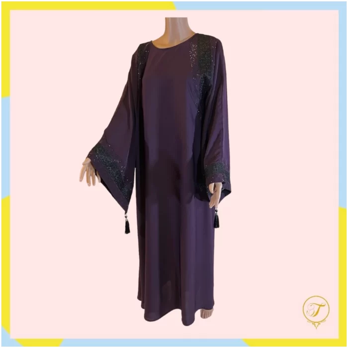 Abaya adorned with exquisite embroidery and delicate beading. This garment combines traditional elegance with intricate