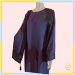 Abaya adorned with exquisite embroidery and delicate beading. This garment combines traditional